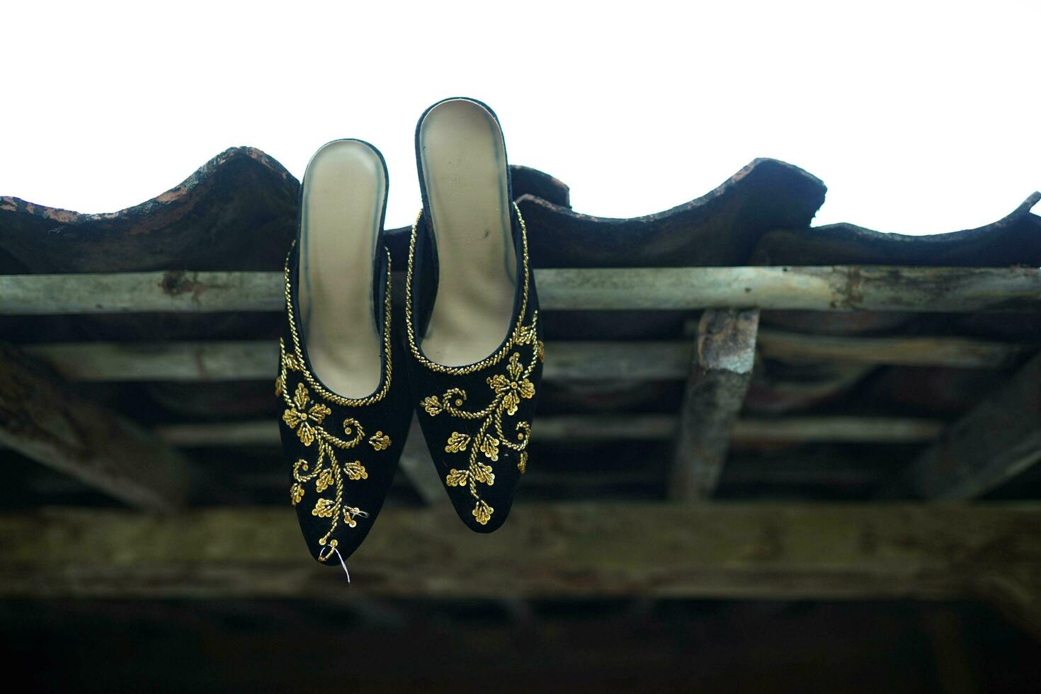 couple wedding shoes for wedding event in the morning on rooftile background photo