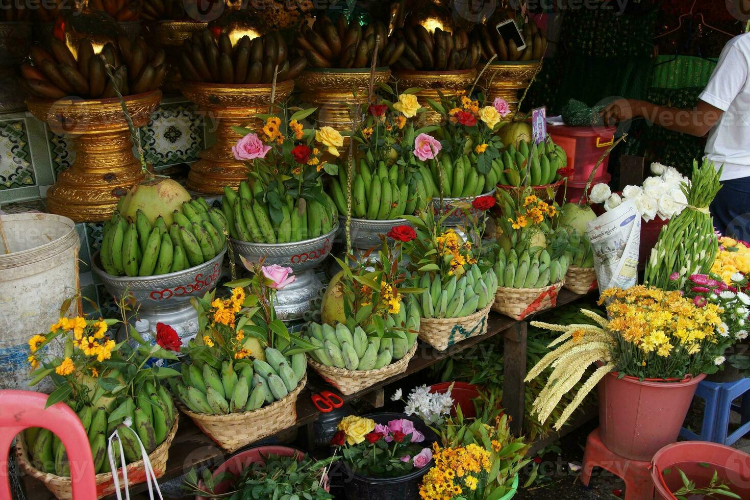 Baskets of green bananas and coconuts photo