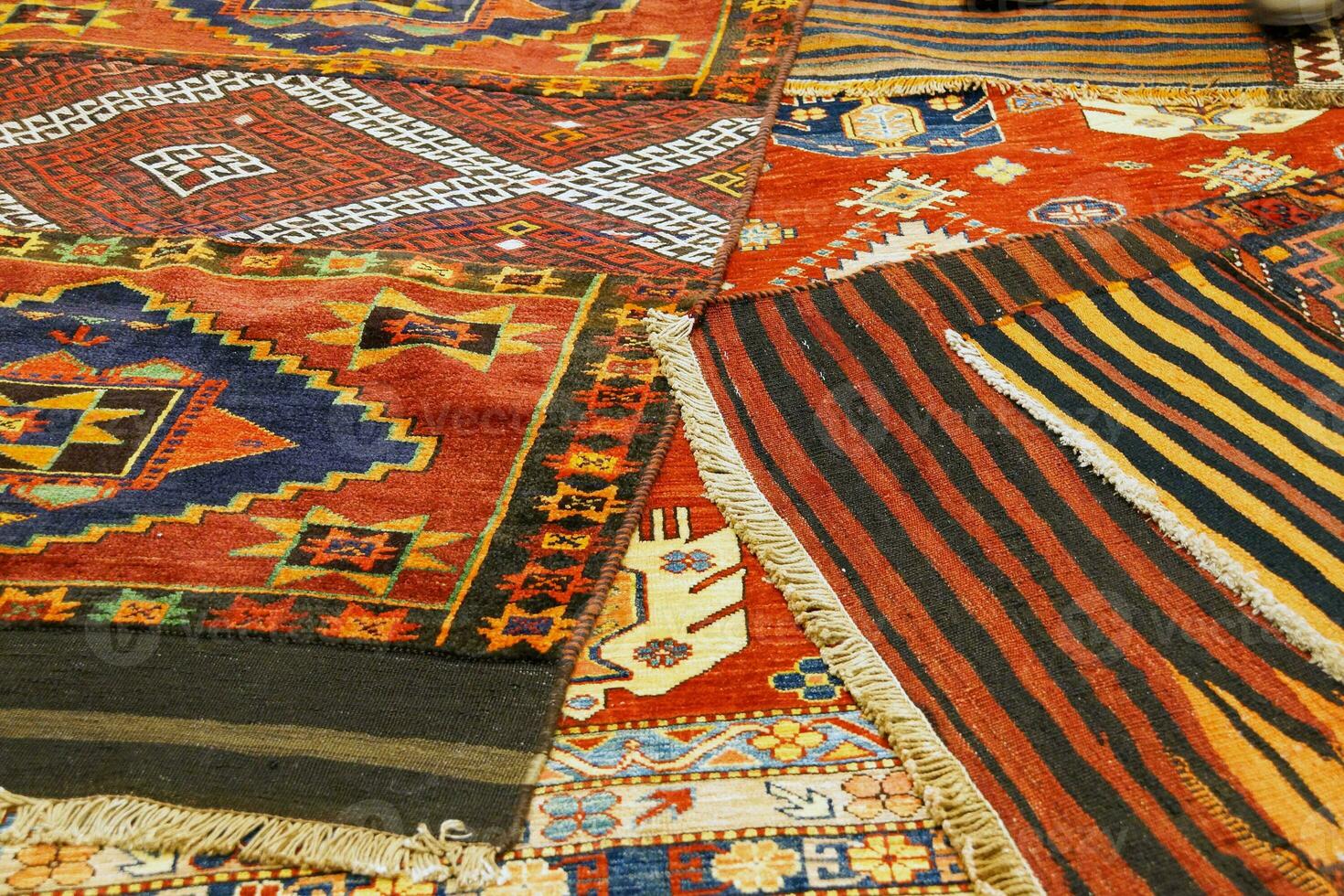 Overlapping carpets with intricate Kurdish  patterns photo