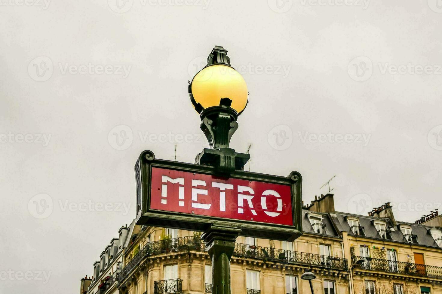 a street sign for metro in paris photo