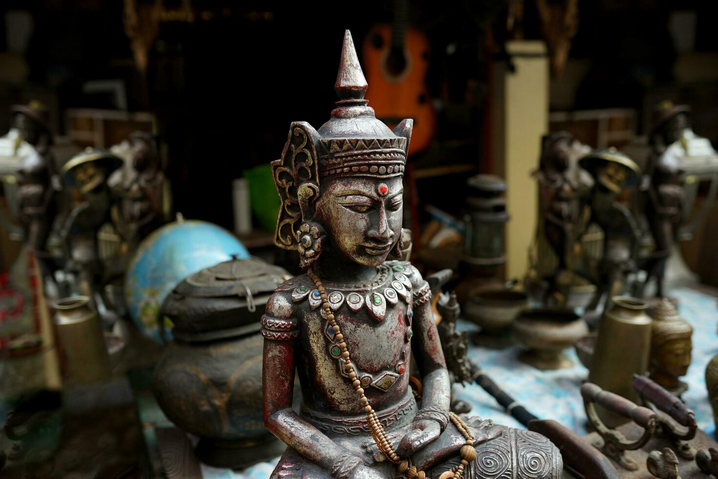 traditional wooden ascetic statue smiling at the art market photo