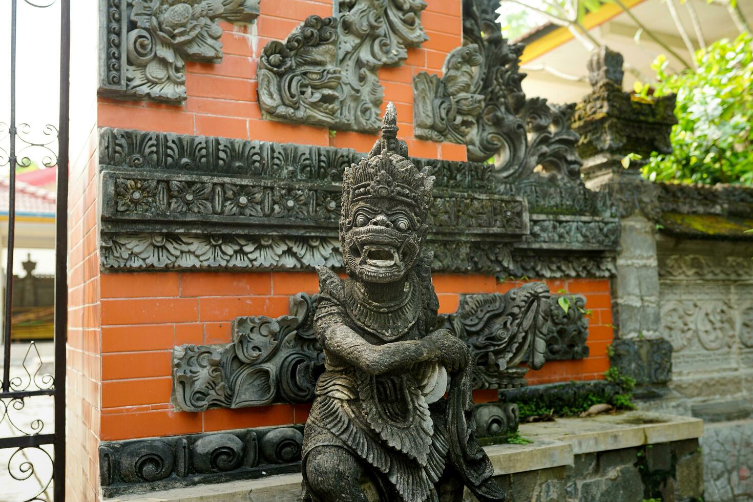 indian monkey, statue of hindu god hanoman on a temple background photo