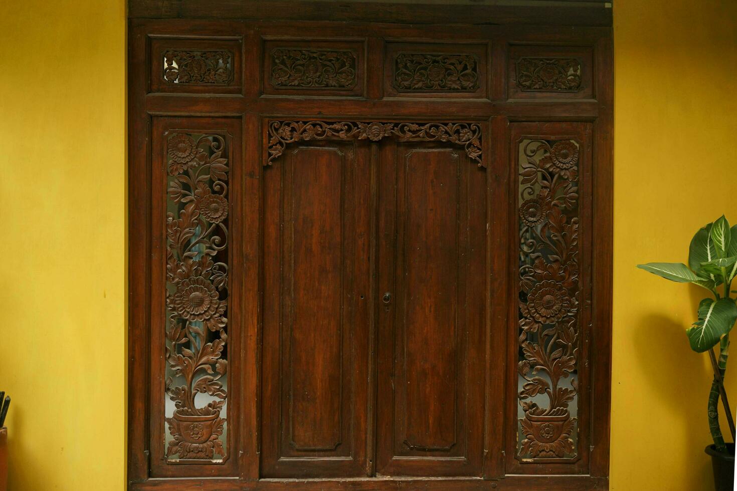 Traditional carved wooden door with beautiful and extraordinary details photo