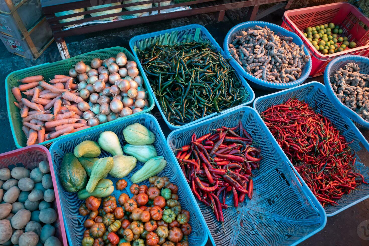 kitchen spices and vegetables on display at the traditional market photo