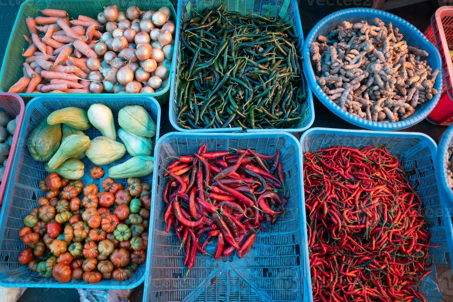 kitchen spices and vegetables on display at the traditional market photo