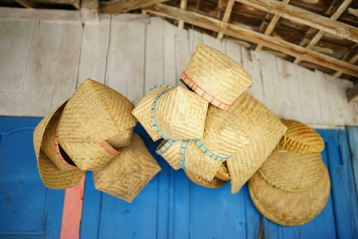 traditional woven bamboo crafts, bamboo hats and bamboo baskets photo