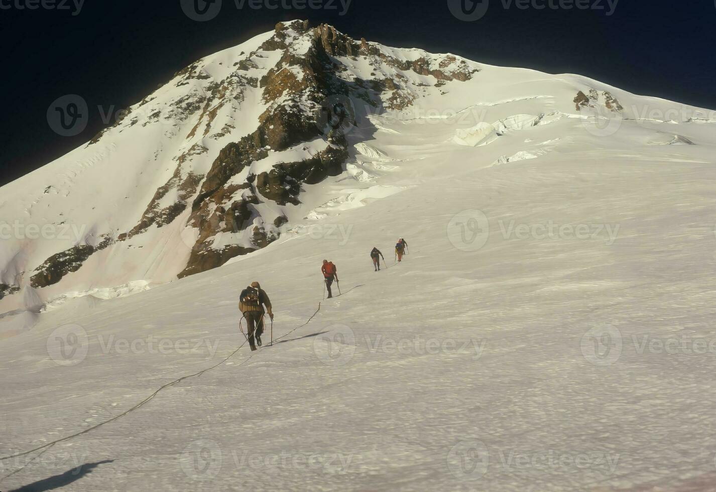 Rope team of climbers photo