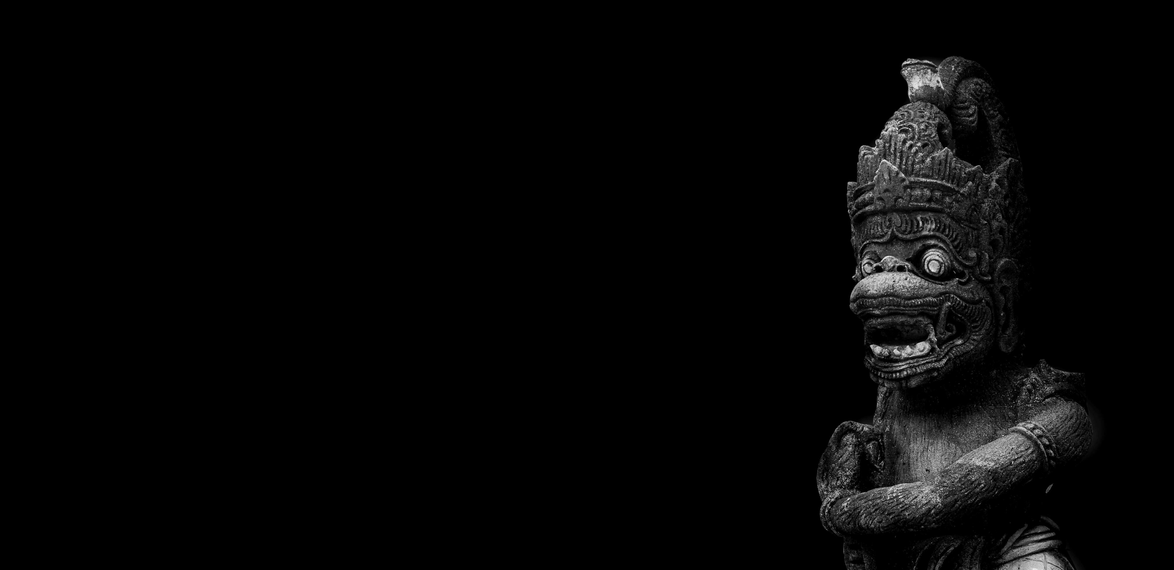 indian monkey, statue of hindu god hanoman on a black background