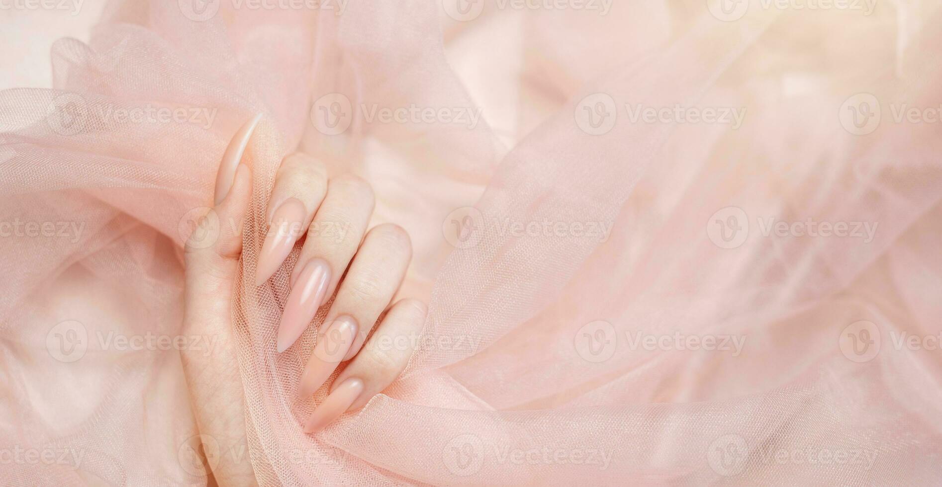 Elegant pastel pink natural manicure. photo