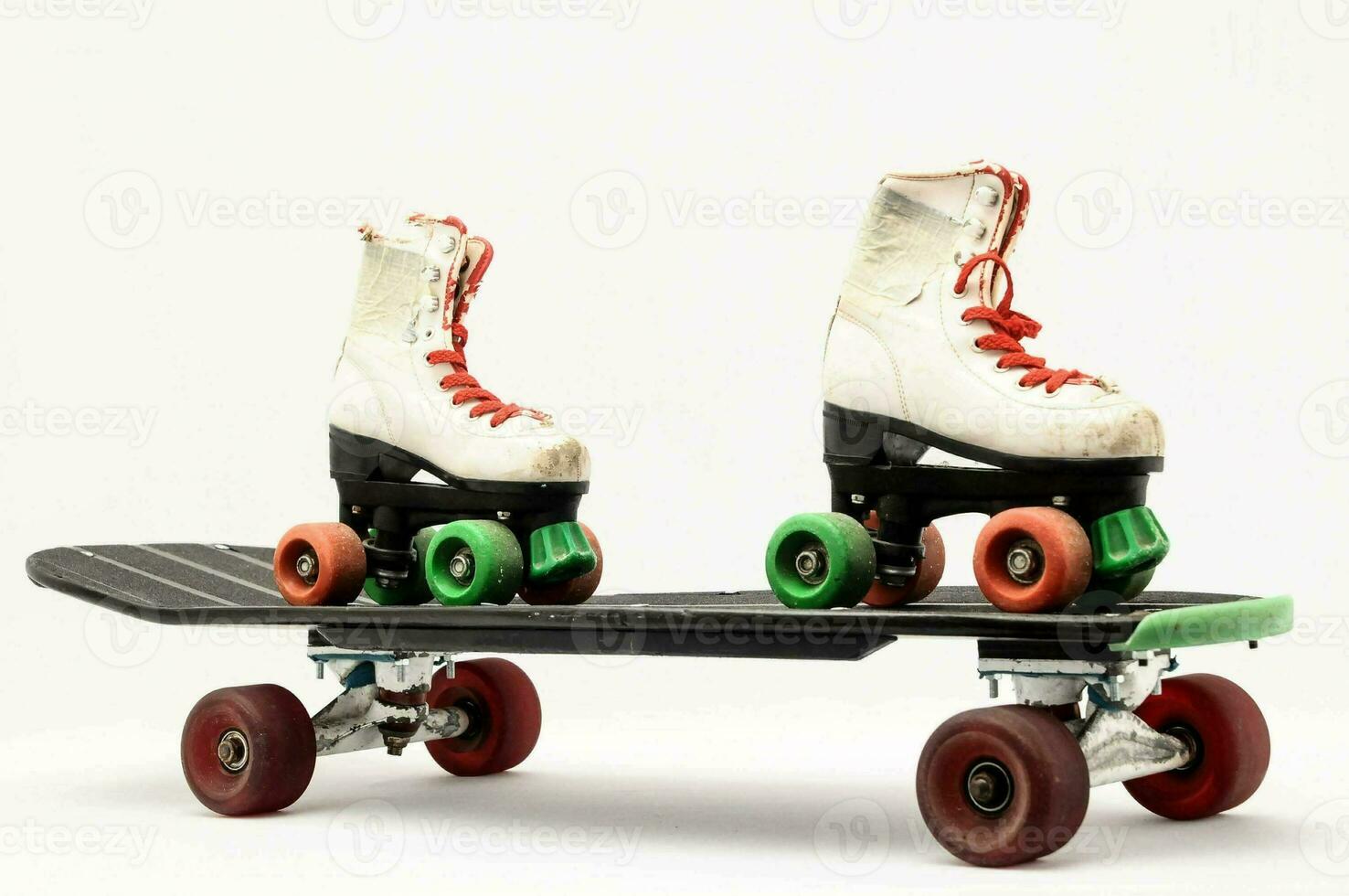 two roller skates on a white background photo