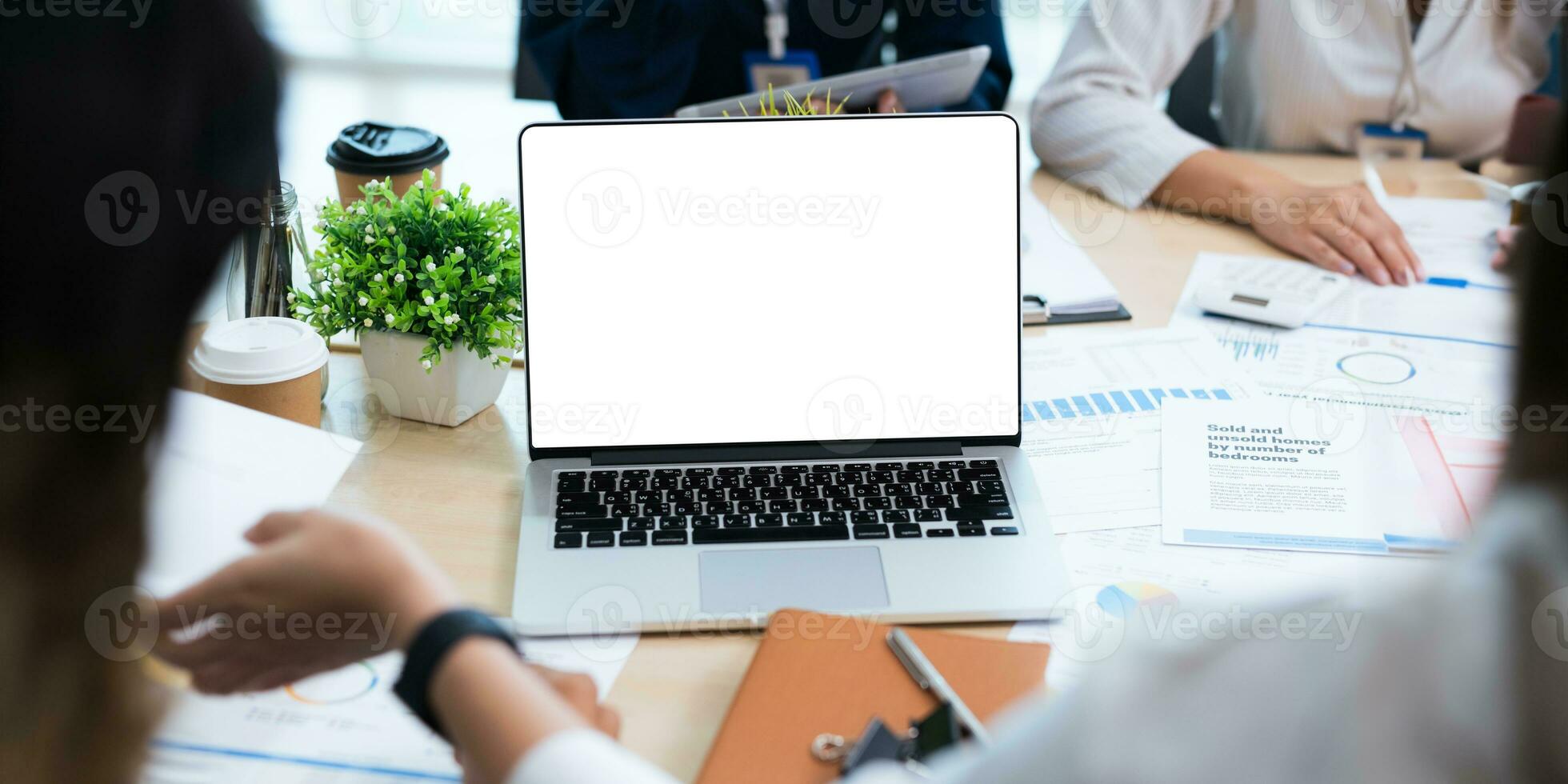 blank screen of man hand working on laptop computer and work while sitting at the table, mockup blank screen for product display or graphic design photo