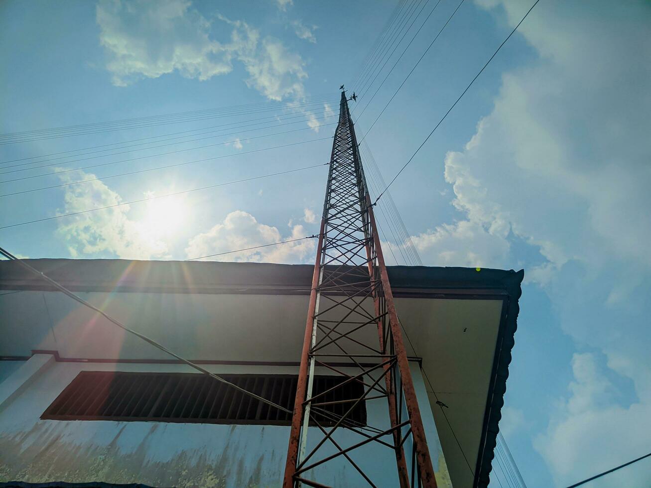 view of tower with buildings against sky background photo