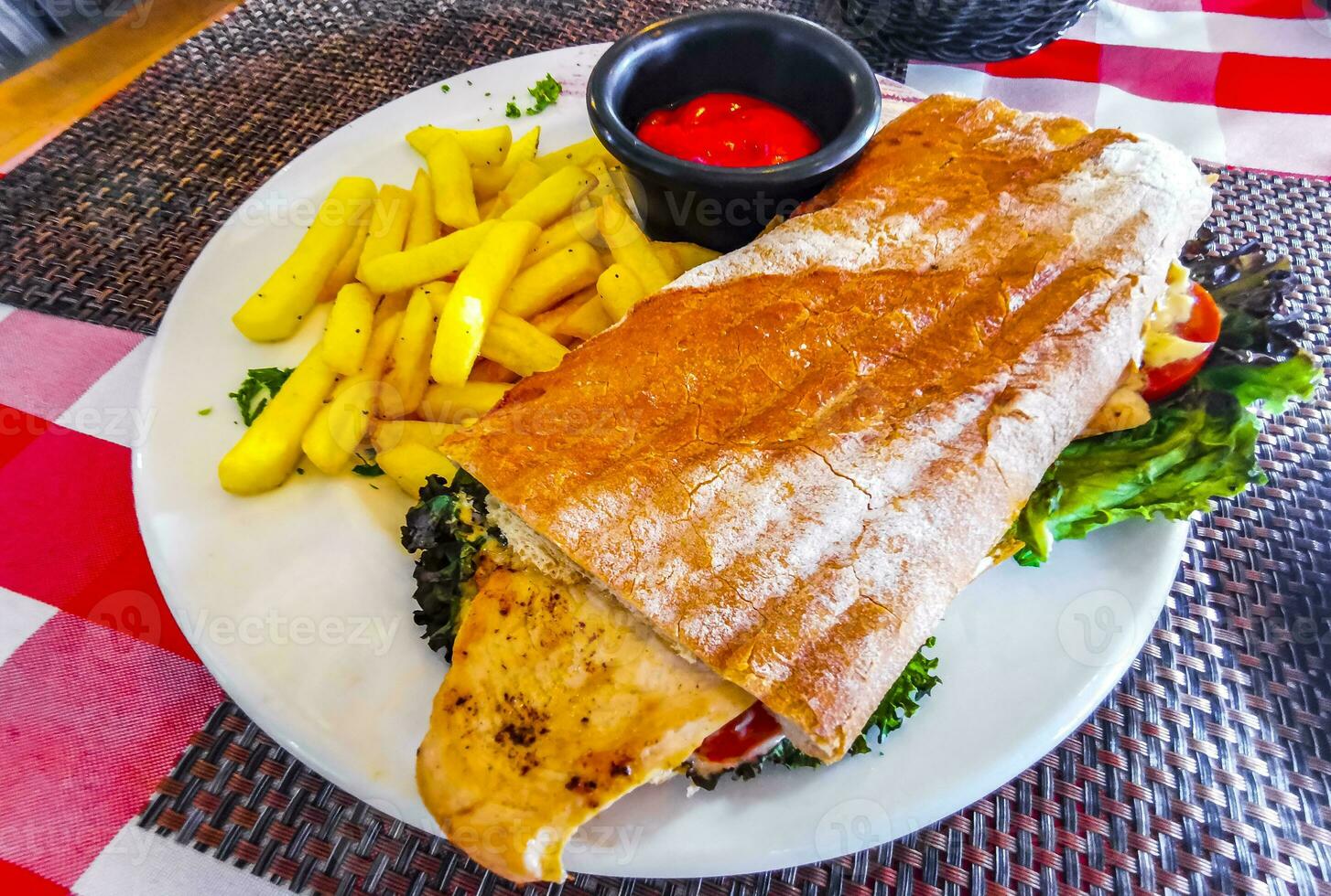 Baguette sandwich toast bread with chicken tomato salad potatoes fries. photo