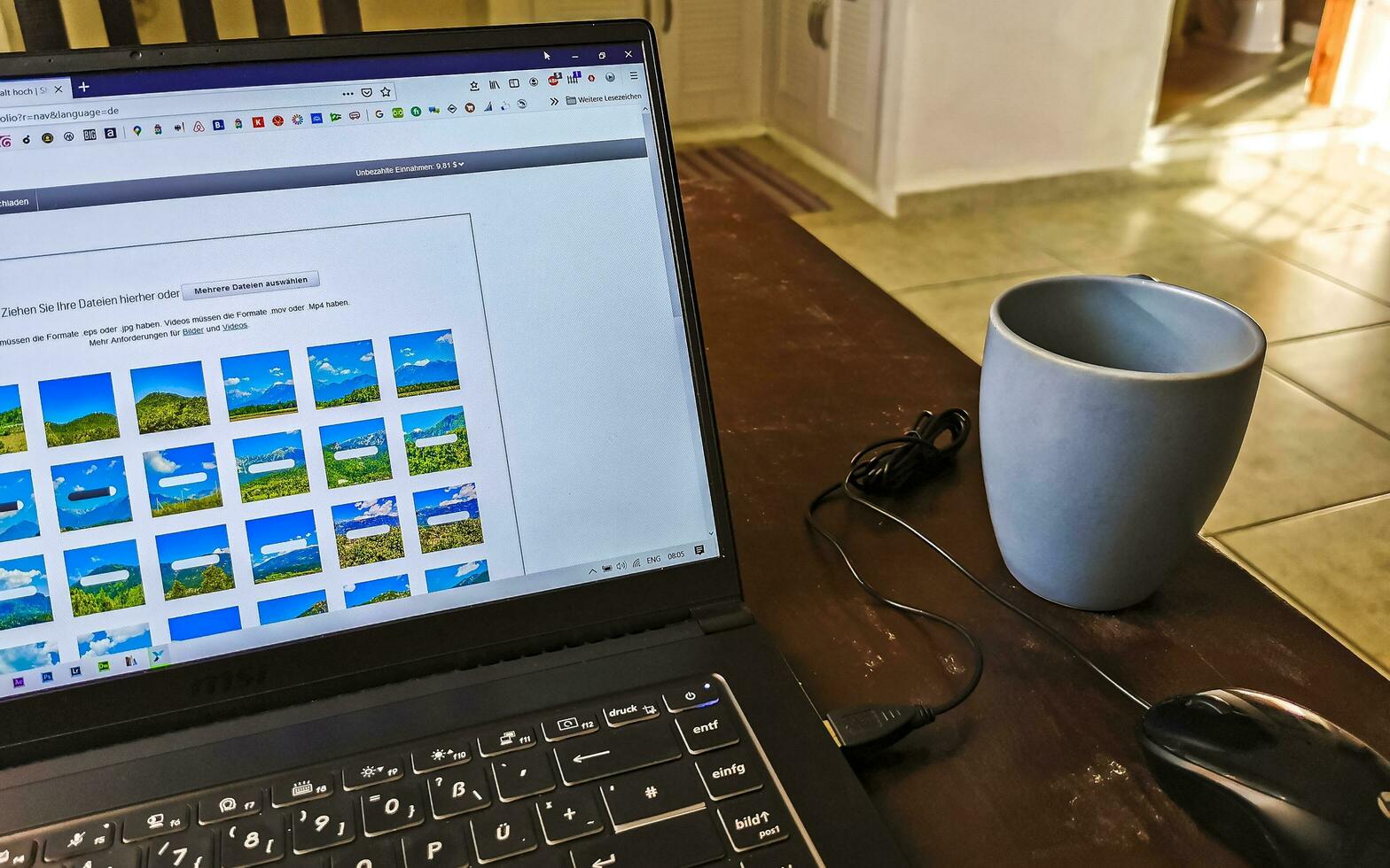 Playa del Carmen Quintana Roo Mexico 2021 Laptop work at table with coffee cup in Mexico. photo