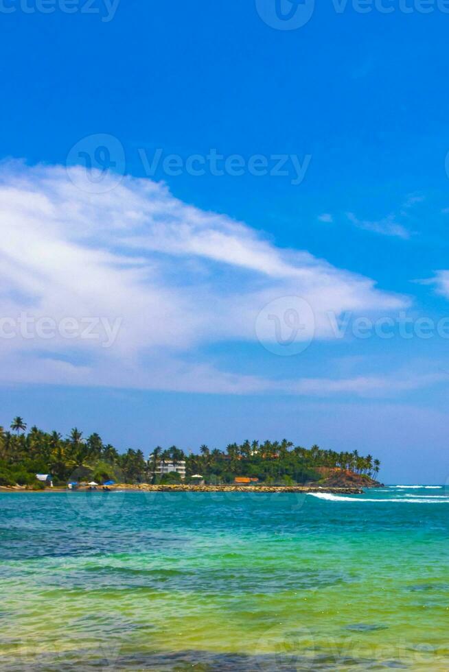 Beautiful paradise tropical beach waves palms Mirissa Beach Sri Lanka. photo