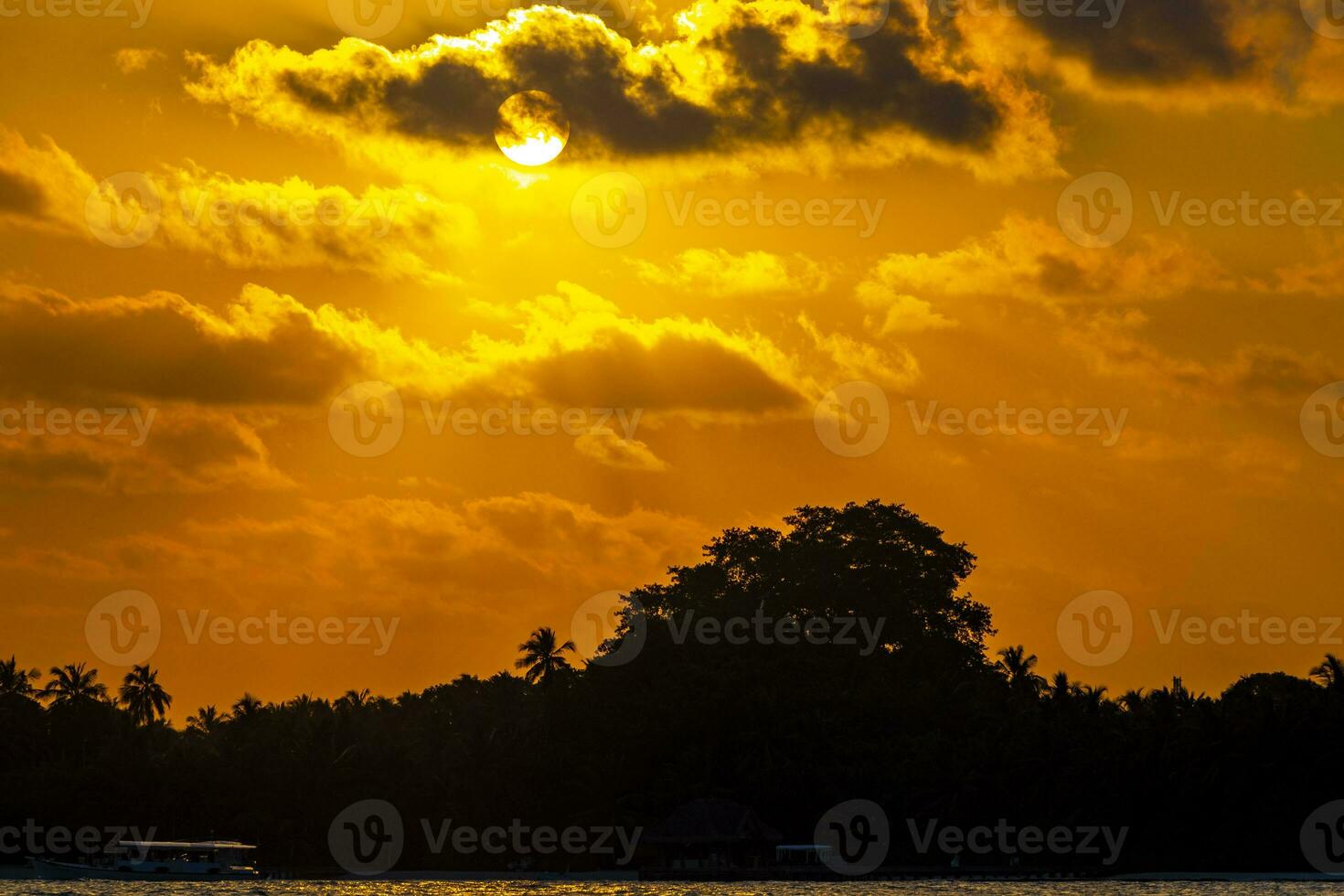 Kuramathi Maldives tropical paradise island sunset view from Rasdhoo. photo