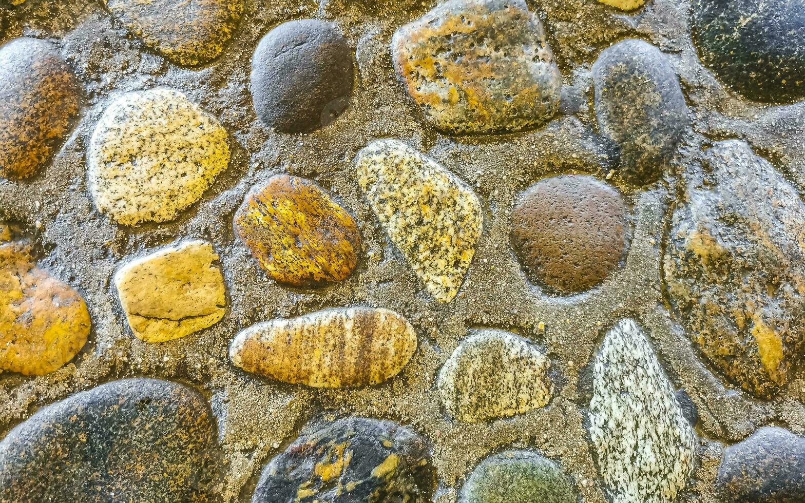 Texture detail of wall with rocks stones brick bricks Mexico. photo