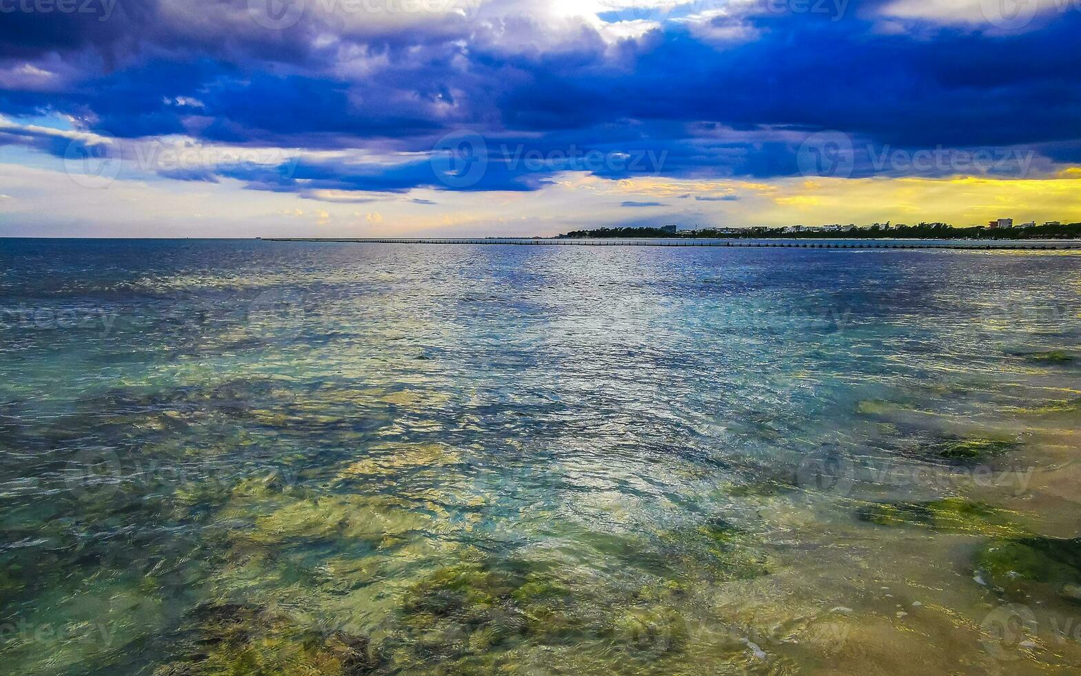 Stones rocks corals turquoise green blue water on beach Mexico. photo