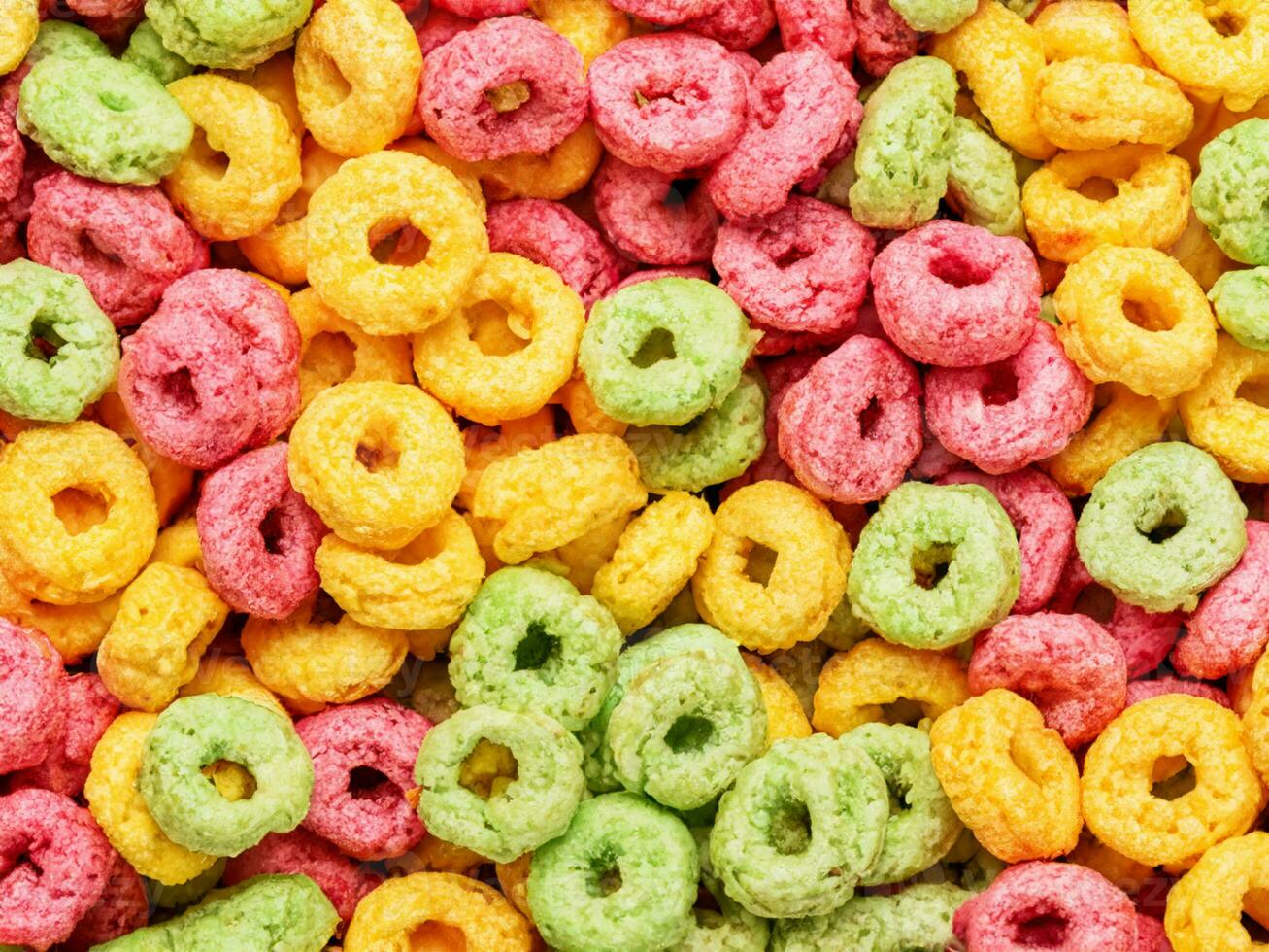 colorful cereal rings on white background photo