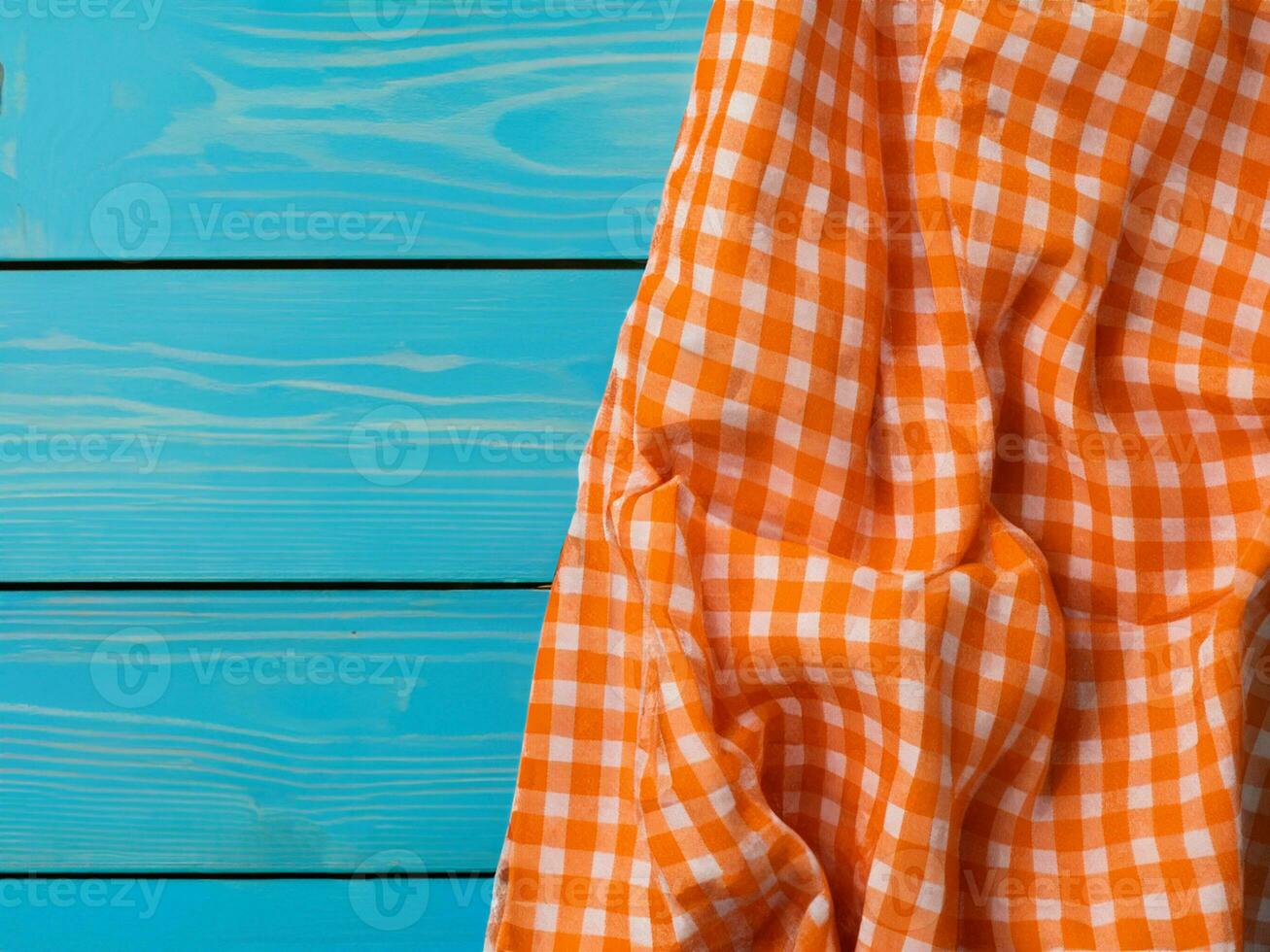 top view of orange striped towel on wooden table photo