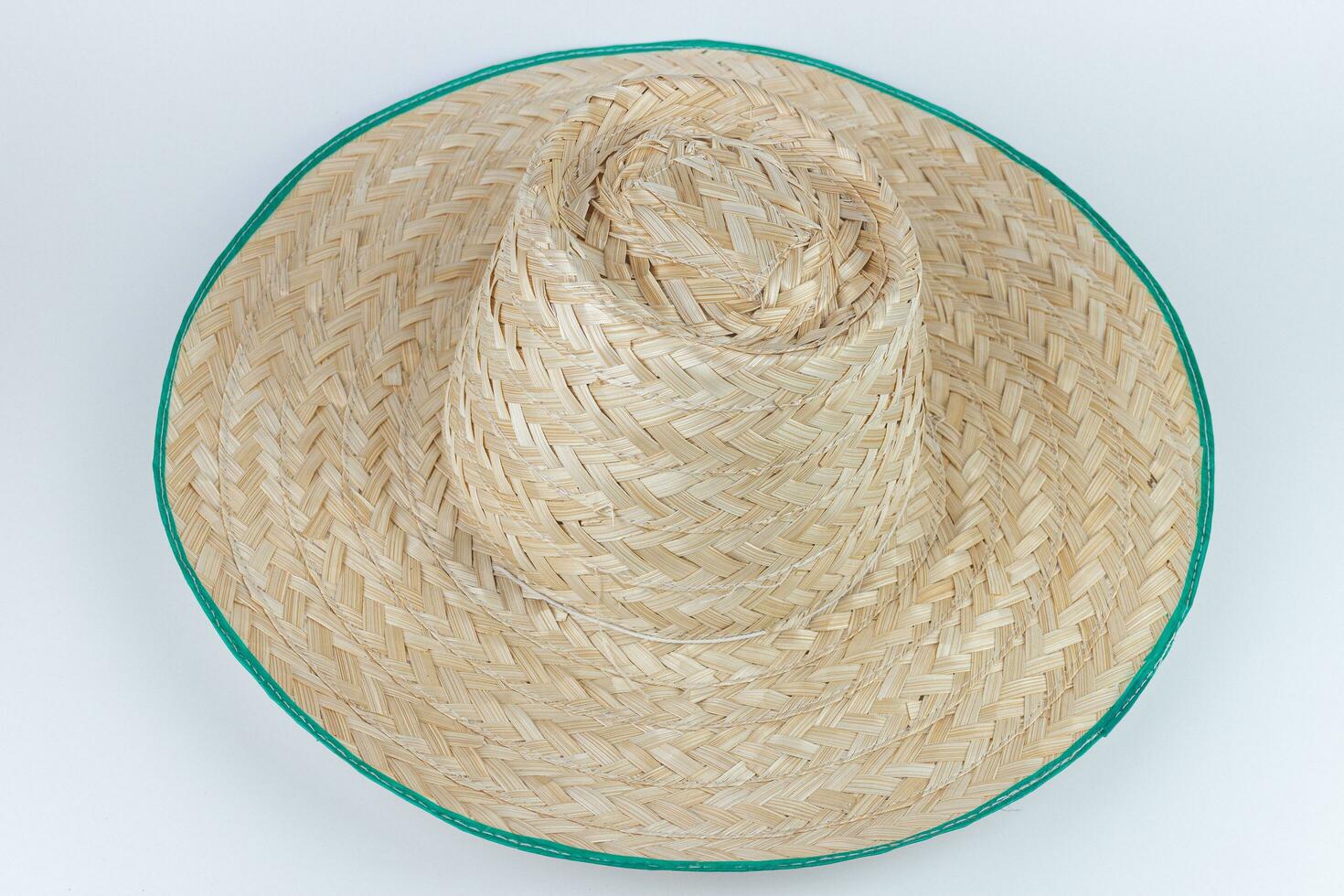 Straw hat isolated on white background. Top view. Flat lay. photo