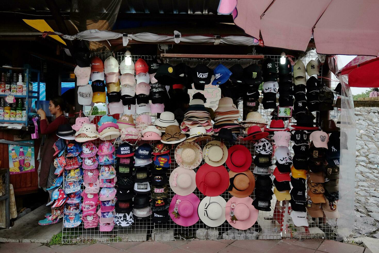 Accessories colorful vintage wool hat on display in outdoor souvenir shop. photo