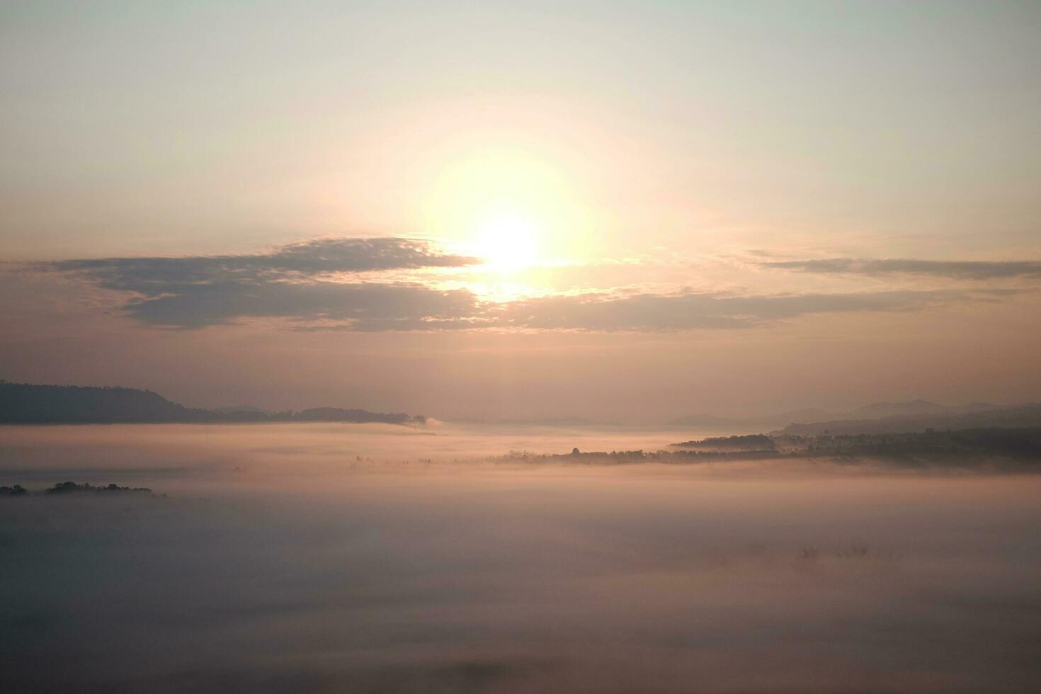 Beautiful Sunset and sunrise on sky and golden twilight time with mist and fog in valley of layer mountain photo