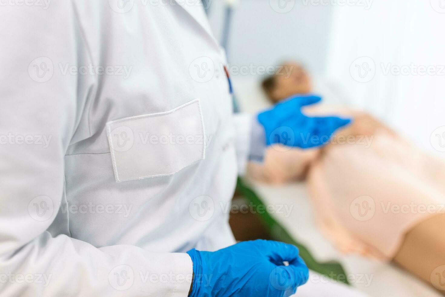 female doctor professional gynecologist examining her patient on a gynecological chair healthcare medicine feminine gynecology concept. photo