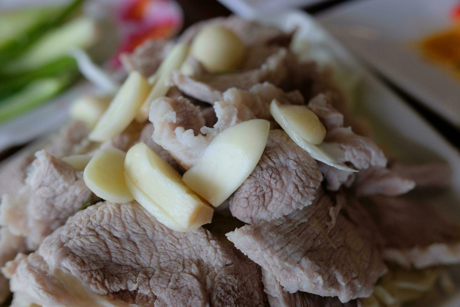 Delicious Boiled spicy pork with lime garlic and chili sauce. photo