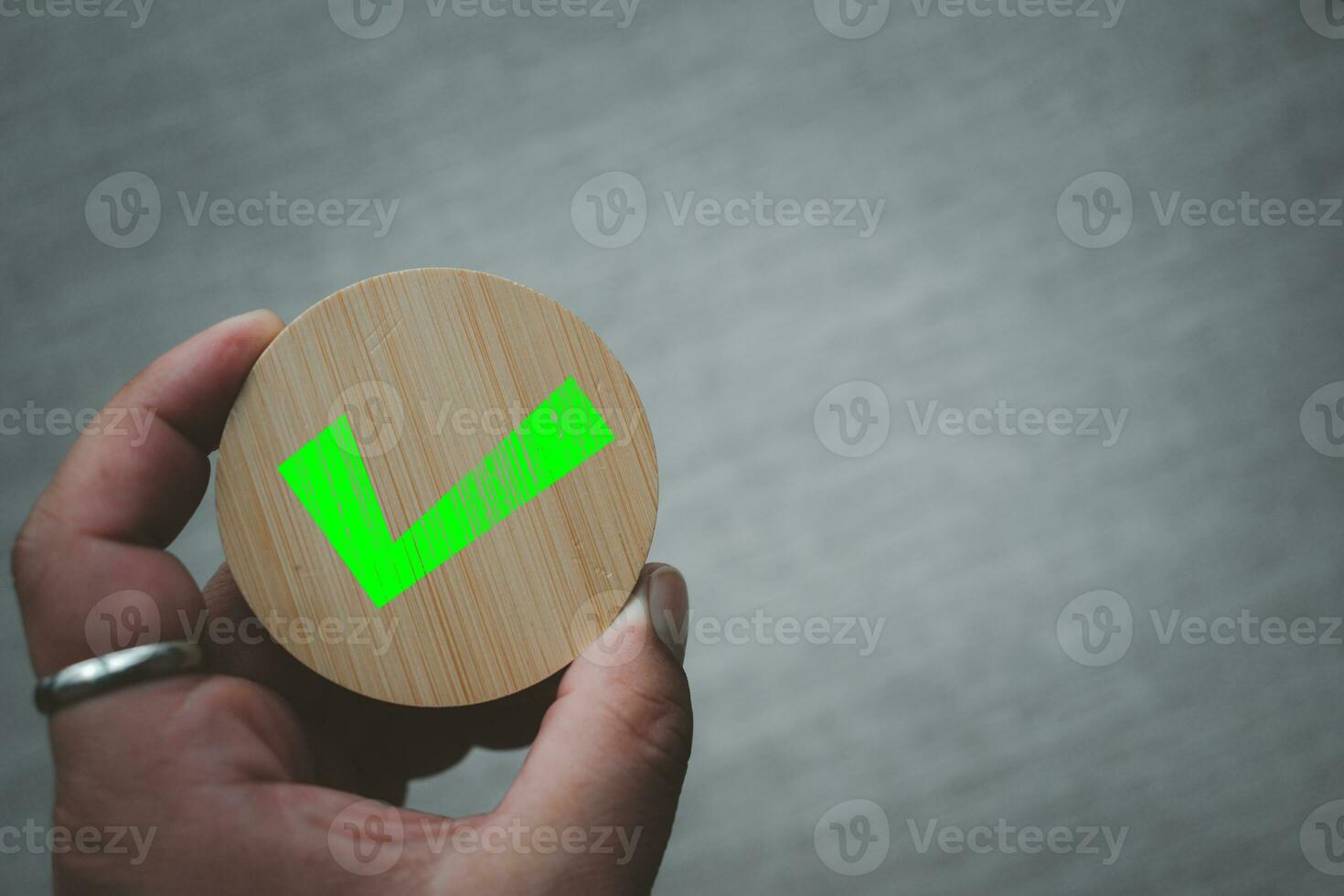 Chosen green check mark by business's hand photo