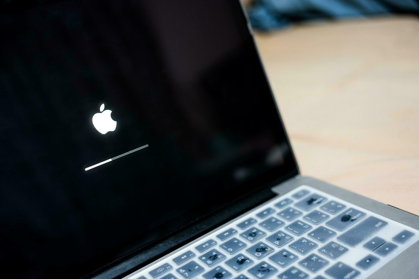 Bangkok, Thailand - October 12, 2023 iOS firmware update process on the screen at the Apple MacBook. photo