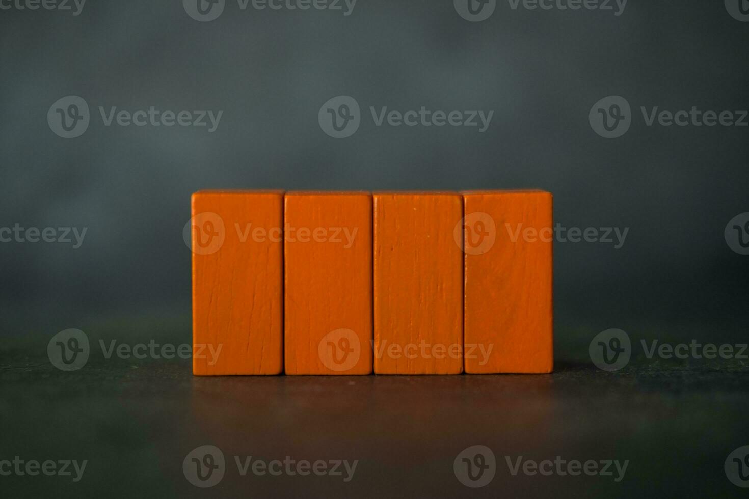 Four rectangle wood orange blocks on a background photo