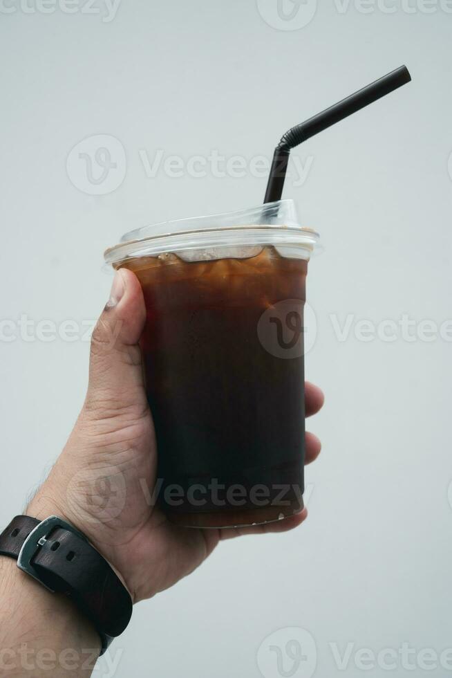 Close up plastic take away cup of iced black coffee photo