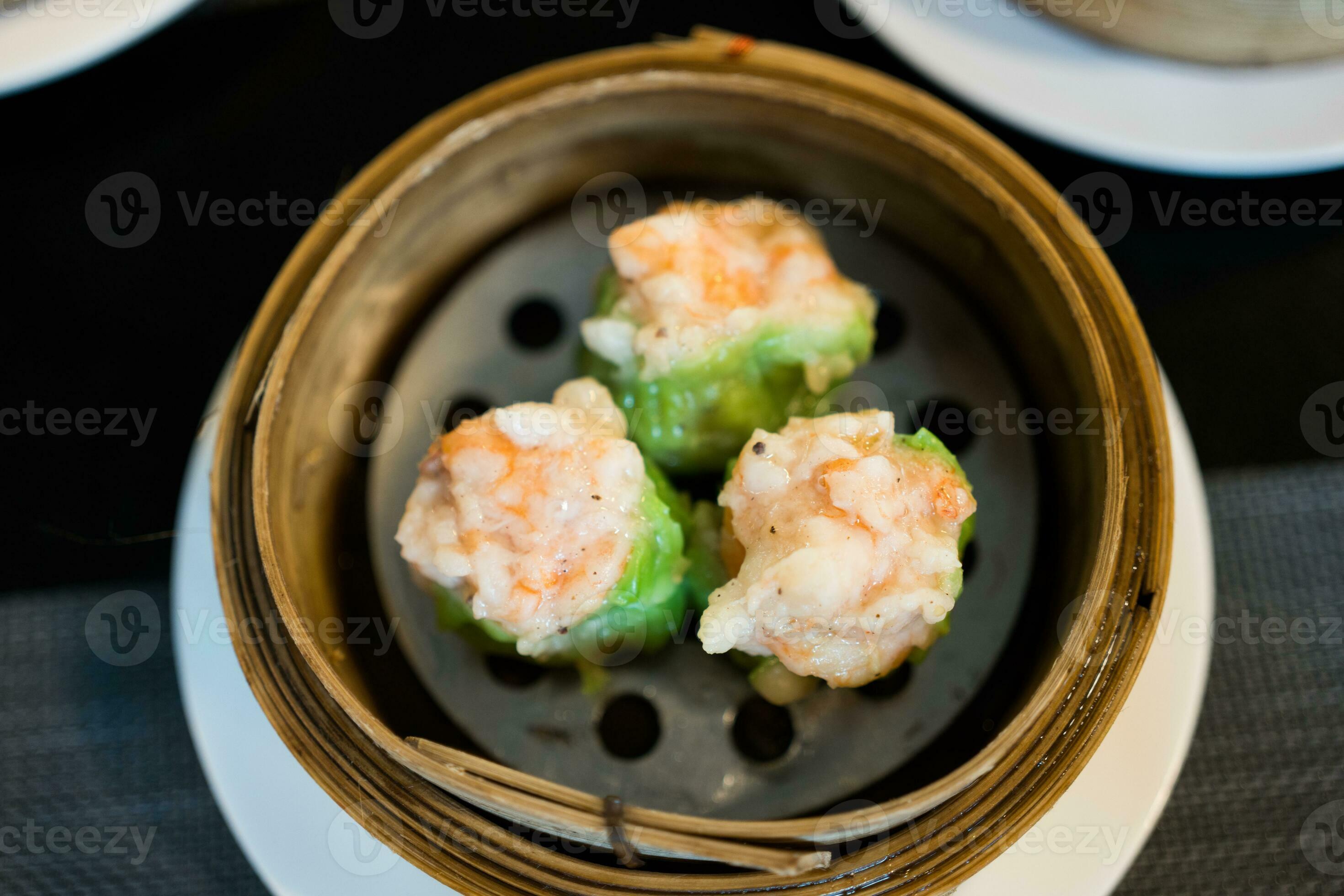 Dim sum, shrimp Chinese steamed dumplings recipe wrapped by green