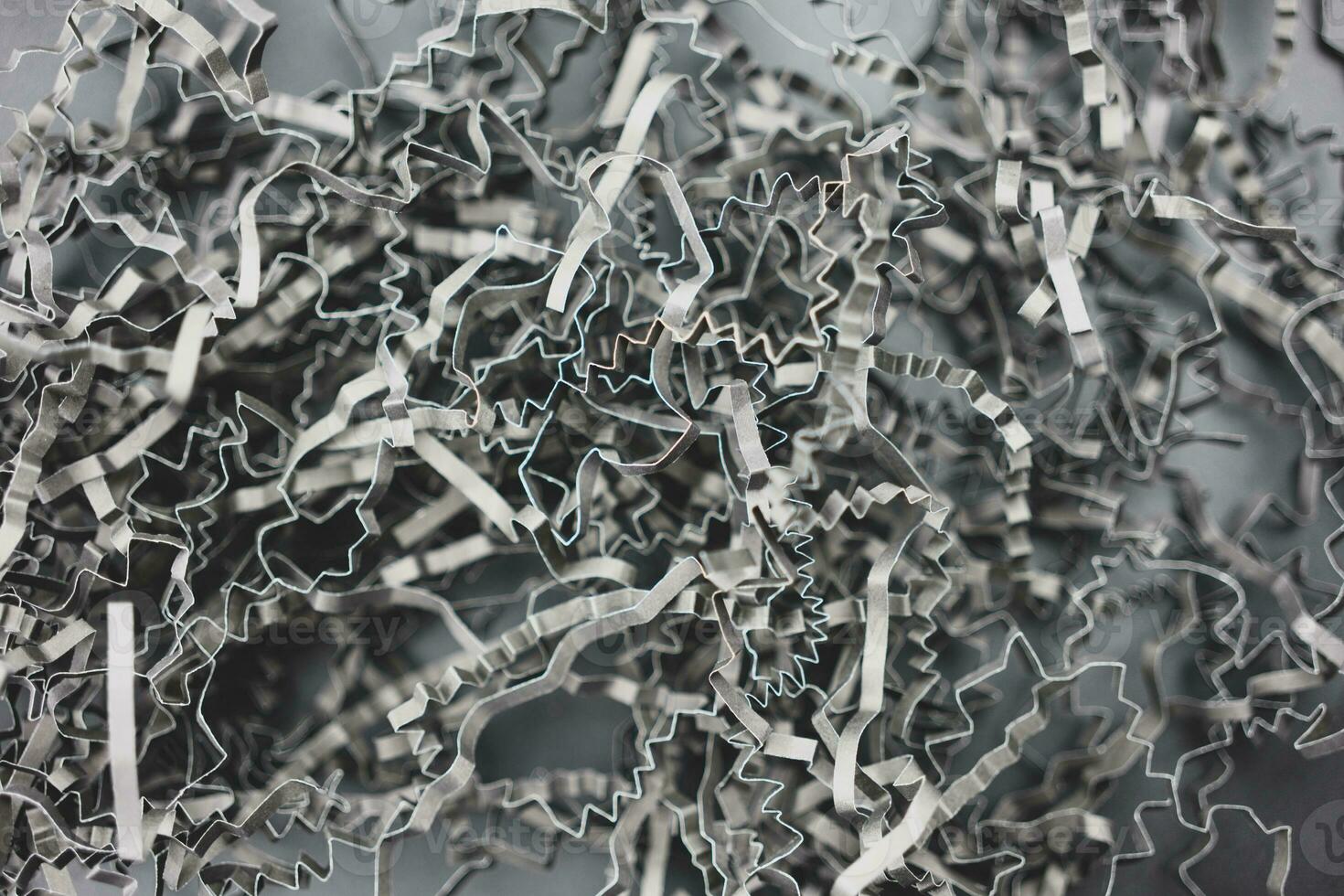 Black shredded paper shot straight down with detail. Destroyed paper uses shockproof in the package. photo