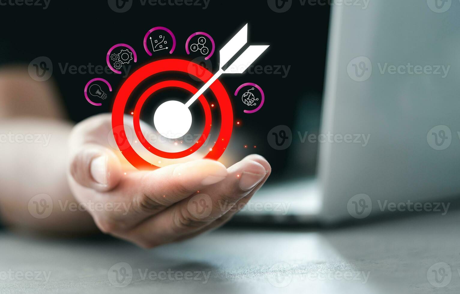 Man hand holding icons target board for successful marketing set up business objective target. photo