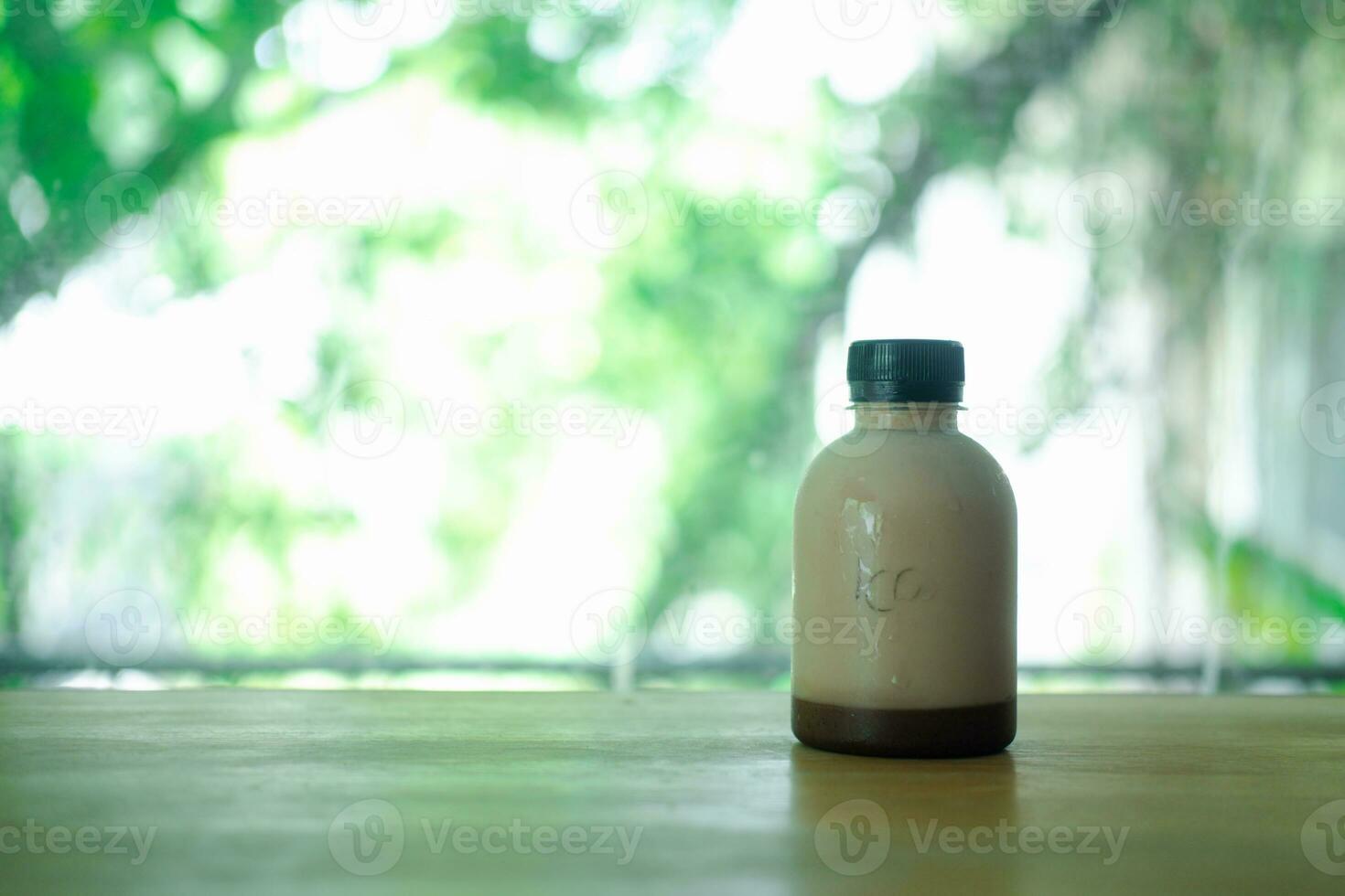 Tasty fresh milk and cocoa in plastic bottle photo