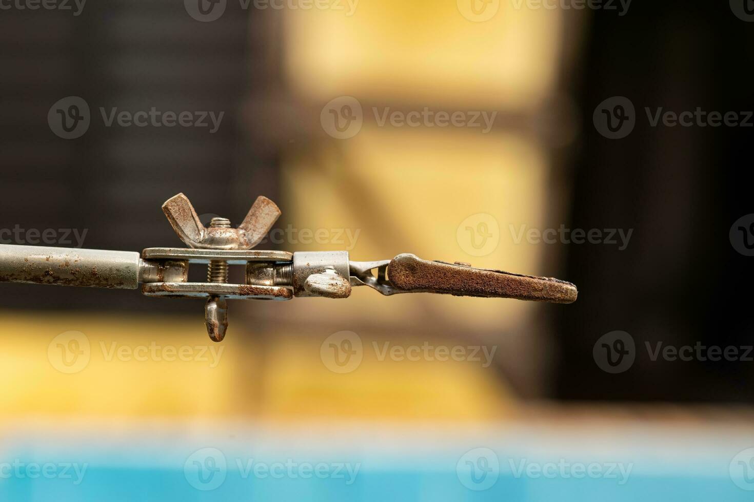 metal support piece with claws with a little oxidation on the steel photo