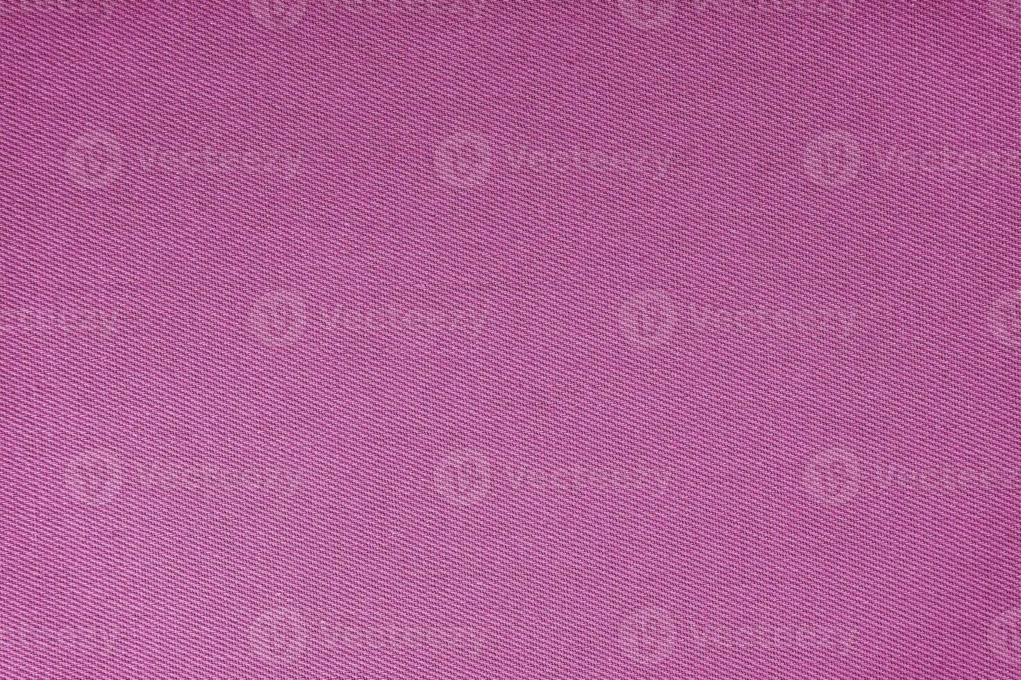 Texture of purple fabric diagonal weave pattern. Decorative textile background photo