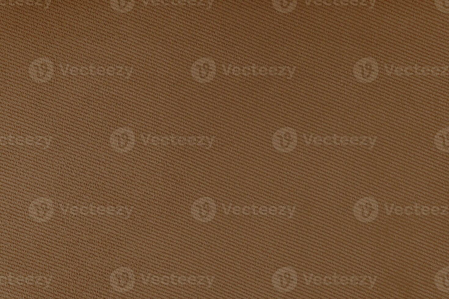 Texture of brown fabric diagonal weave pattern. Decorative textile background photo