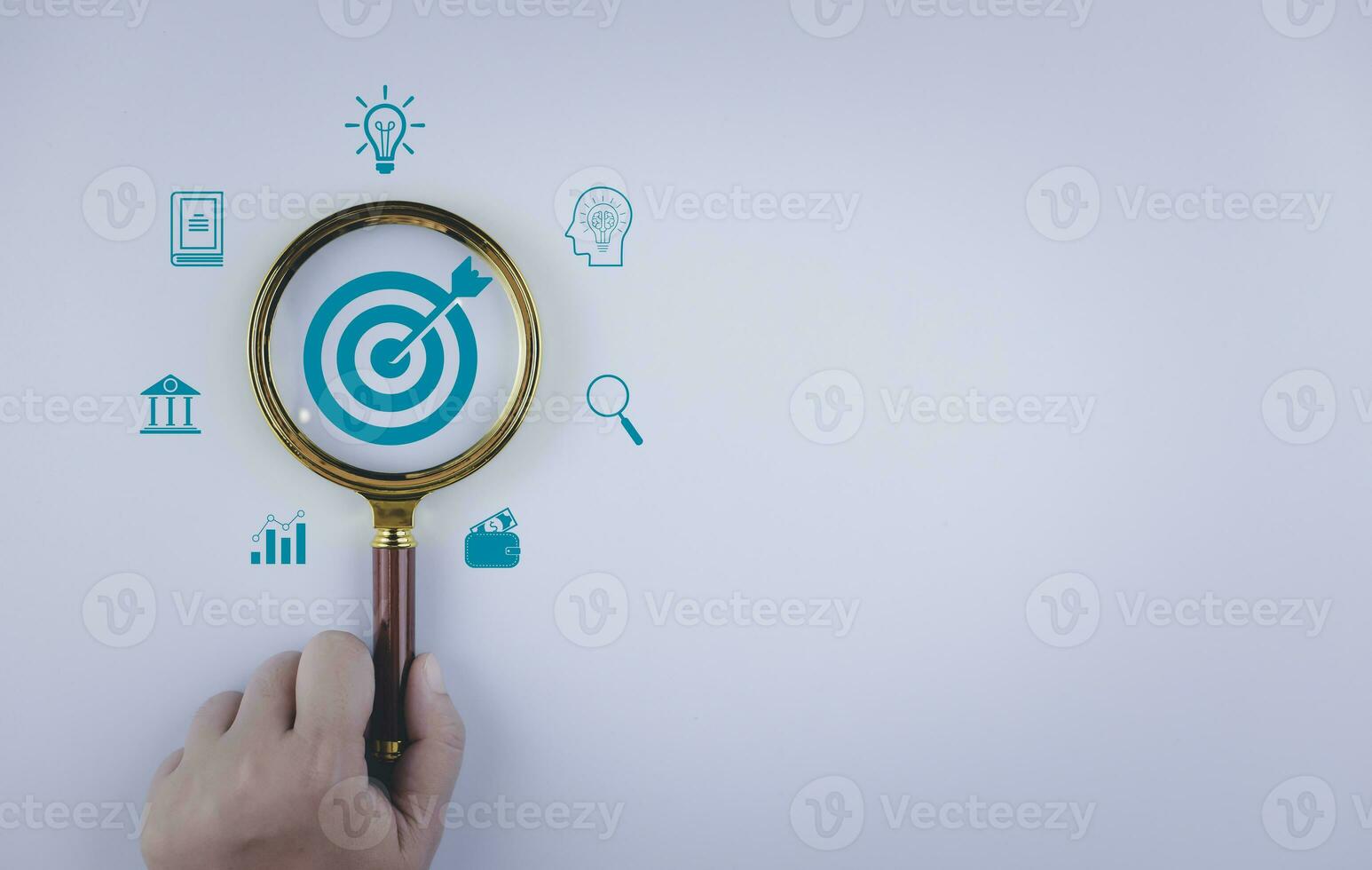 Magnifying glass focus with target objectives with business icons,  Business plan strategies, Business annual plan and development for achieving goals planning development leadership, customer target photo