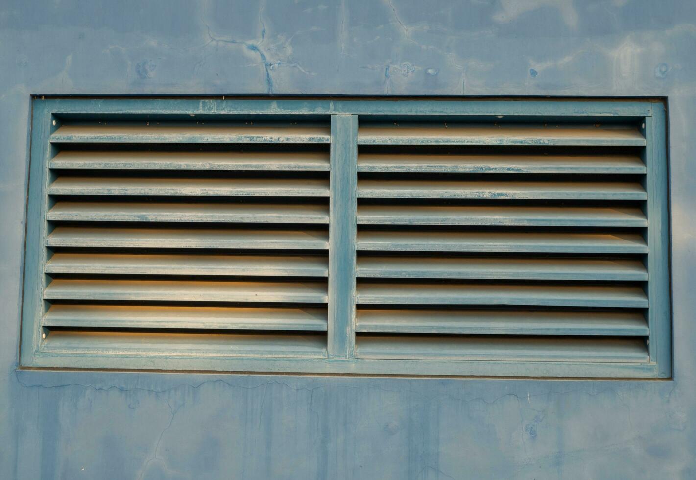 Blue windows air ventilation on power plant building. The photo is suitable to use for architect content media and building background.