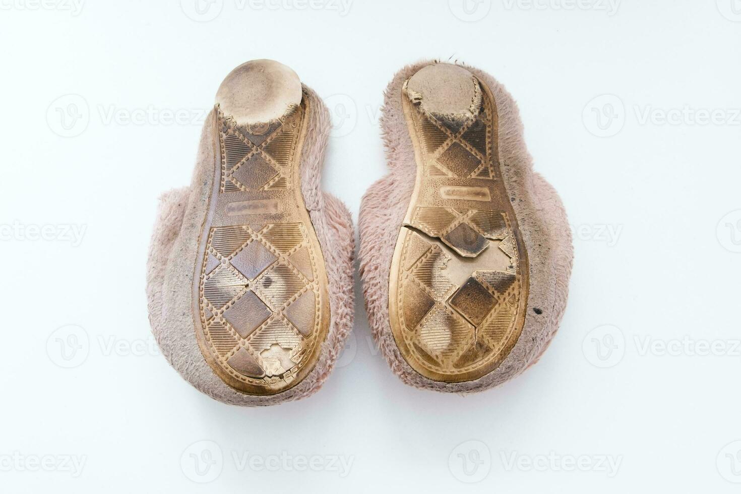 Old torn home slippers photo