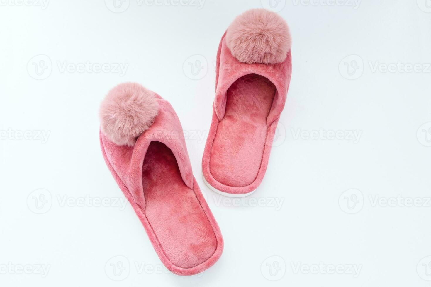 Cute home pink fluffy slippers on white background photo