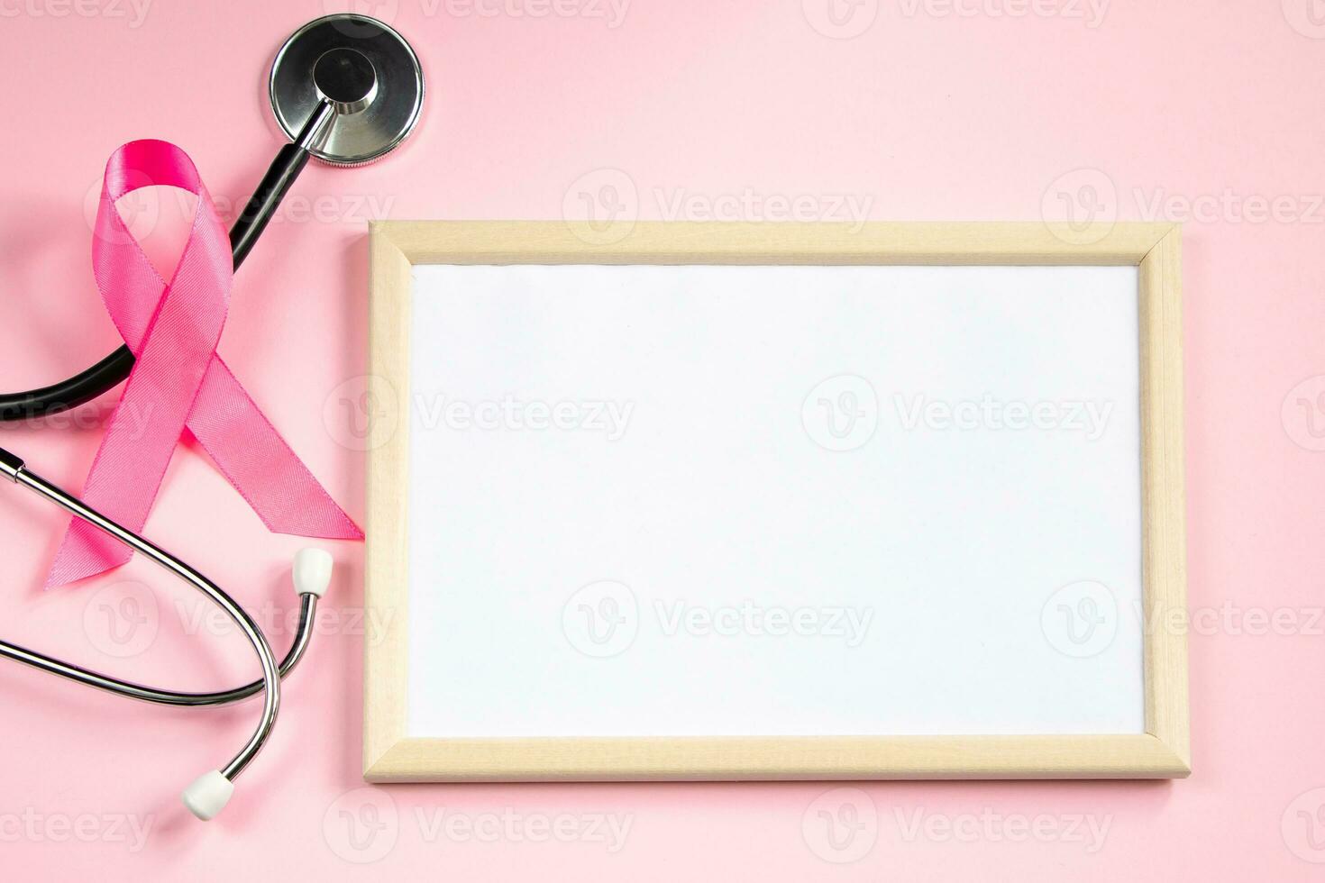 Breast Cancer Awareness Month. Pink ribbon fight symbol. Empty frame mocap for text. Women's health care concept. photo