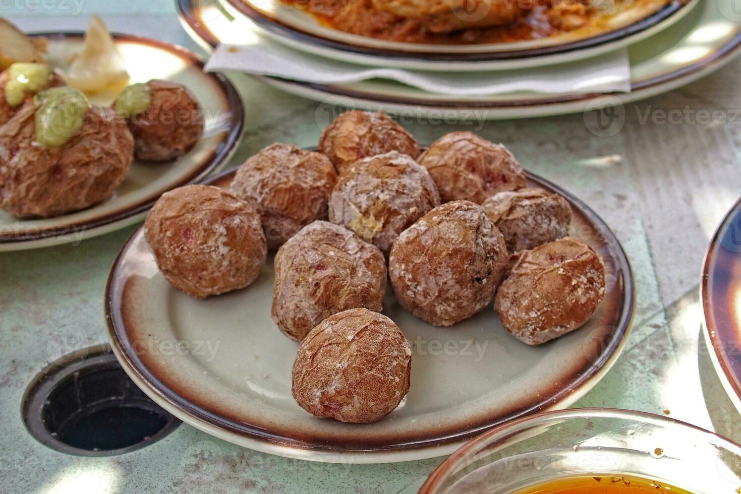 tasty Canarian potatoes cooked with a skin in seawater and served with a regional green sauce photo