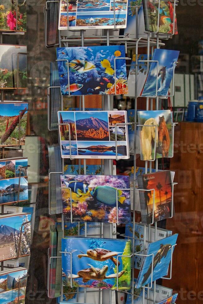 stand with colorful postcards in a souvenir shop on the Spanish island of Tenerife photo