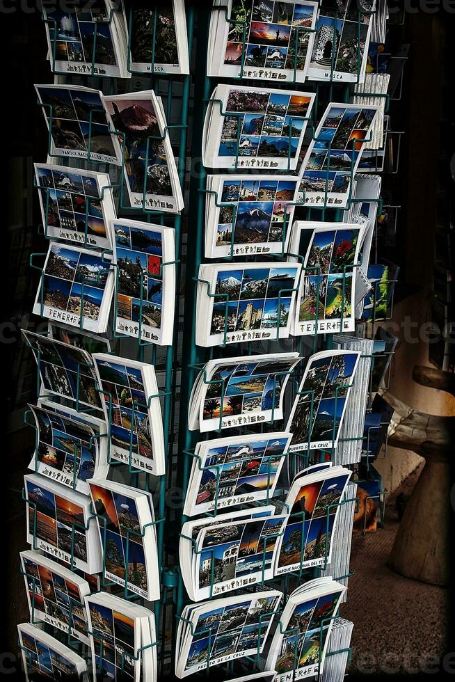 stand with colorful postcards in a souvenir shop on the Spanish island of Tenerife photo