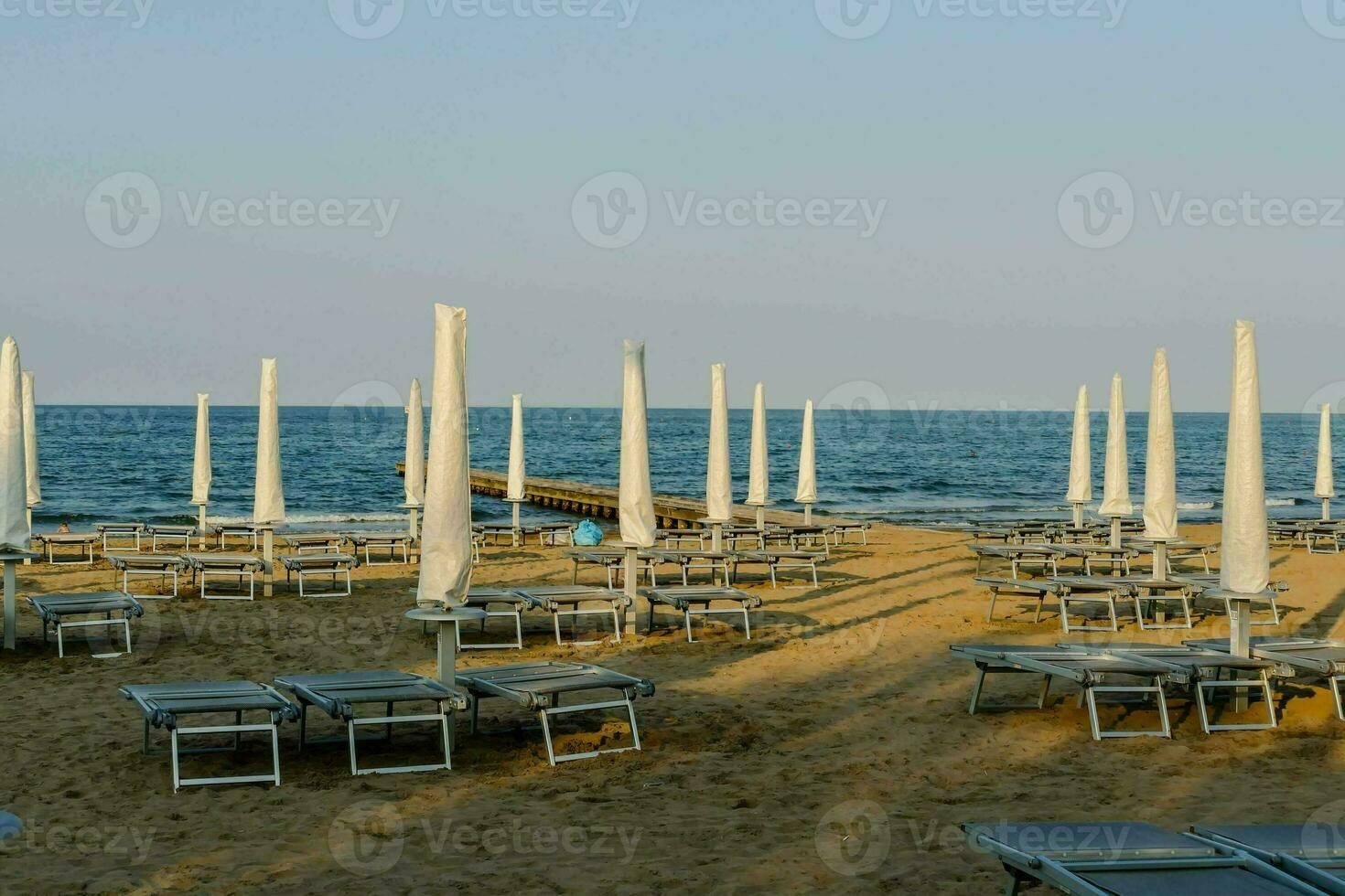 beach chairs and umbrellas on the sand photo