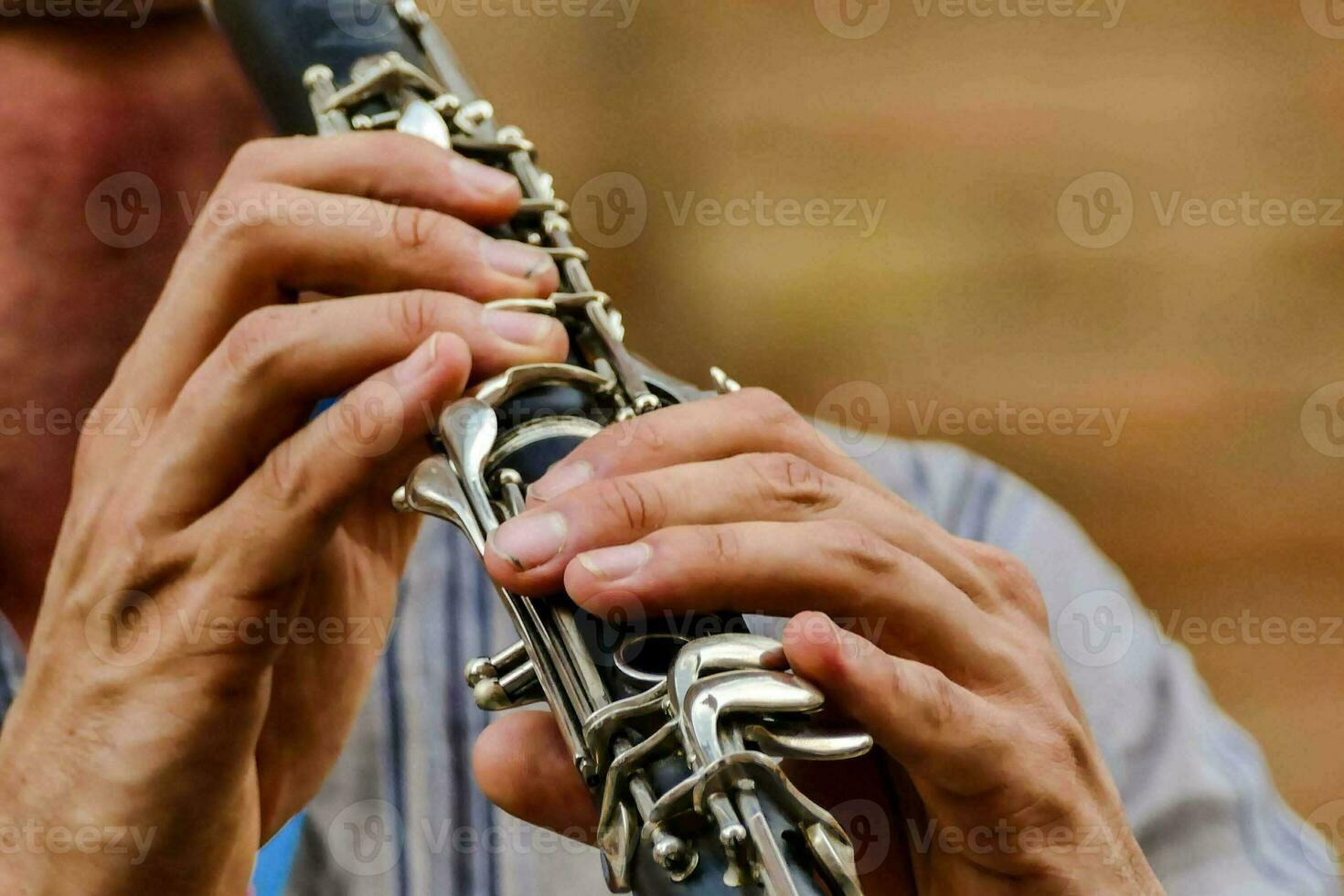 a man is playing the clarinet photo